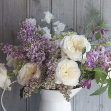 Arrangement of Patience roses with Charming milky buds ruffle out into ivory sculpted cups of delicate, lace-like petals revealing a creamy colored centre with just a hint of pale, buttery yellow.