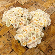 3 bouquets of Cream color roses with hints of purple and orange. 
